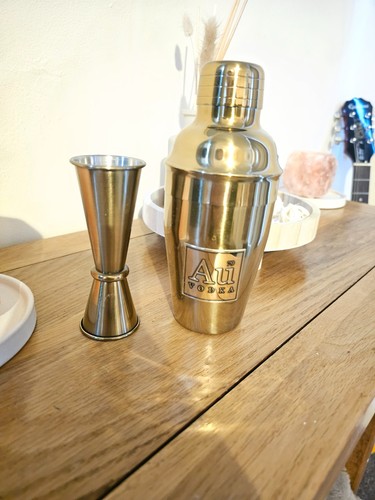 Cocktail shaker and jigger - and,